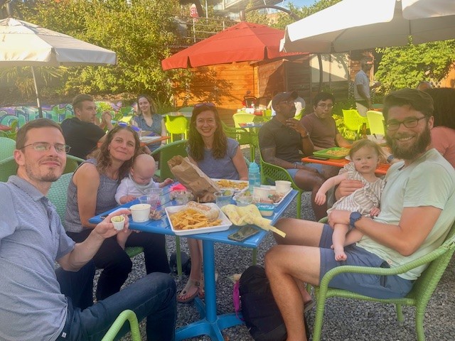 People at table outdoors